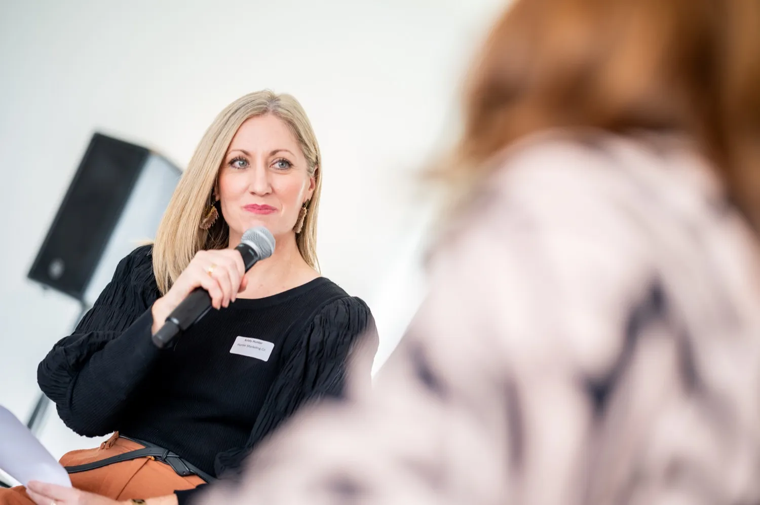 Kristy Hunter presenting as a guest speaker at a marketing event